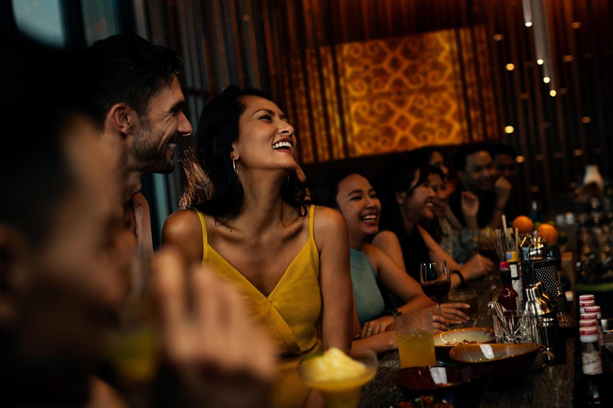 Hotel Hyatt Centric Kota Kinabalu Exterior foto A woman laughing with friends